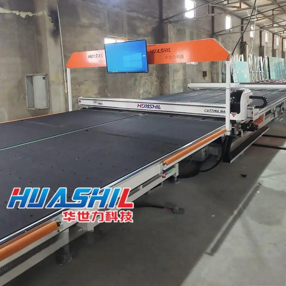 How does the lubrication system work in a CNC glass cutting machine?